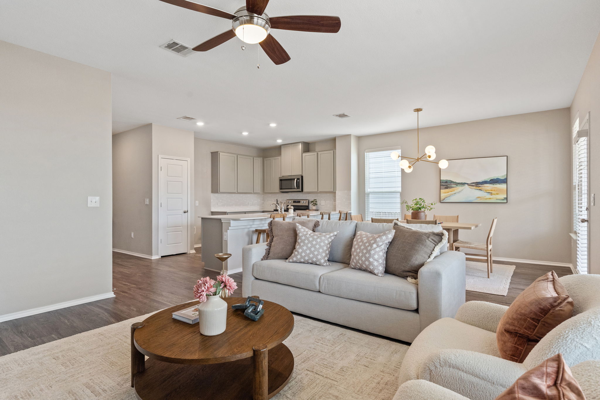 7504 Groundhog Way Austin, TX 78744 - Photo 9 of 22 a living room with furniture kitchen view and a chandelier