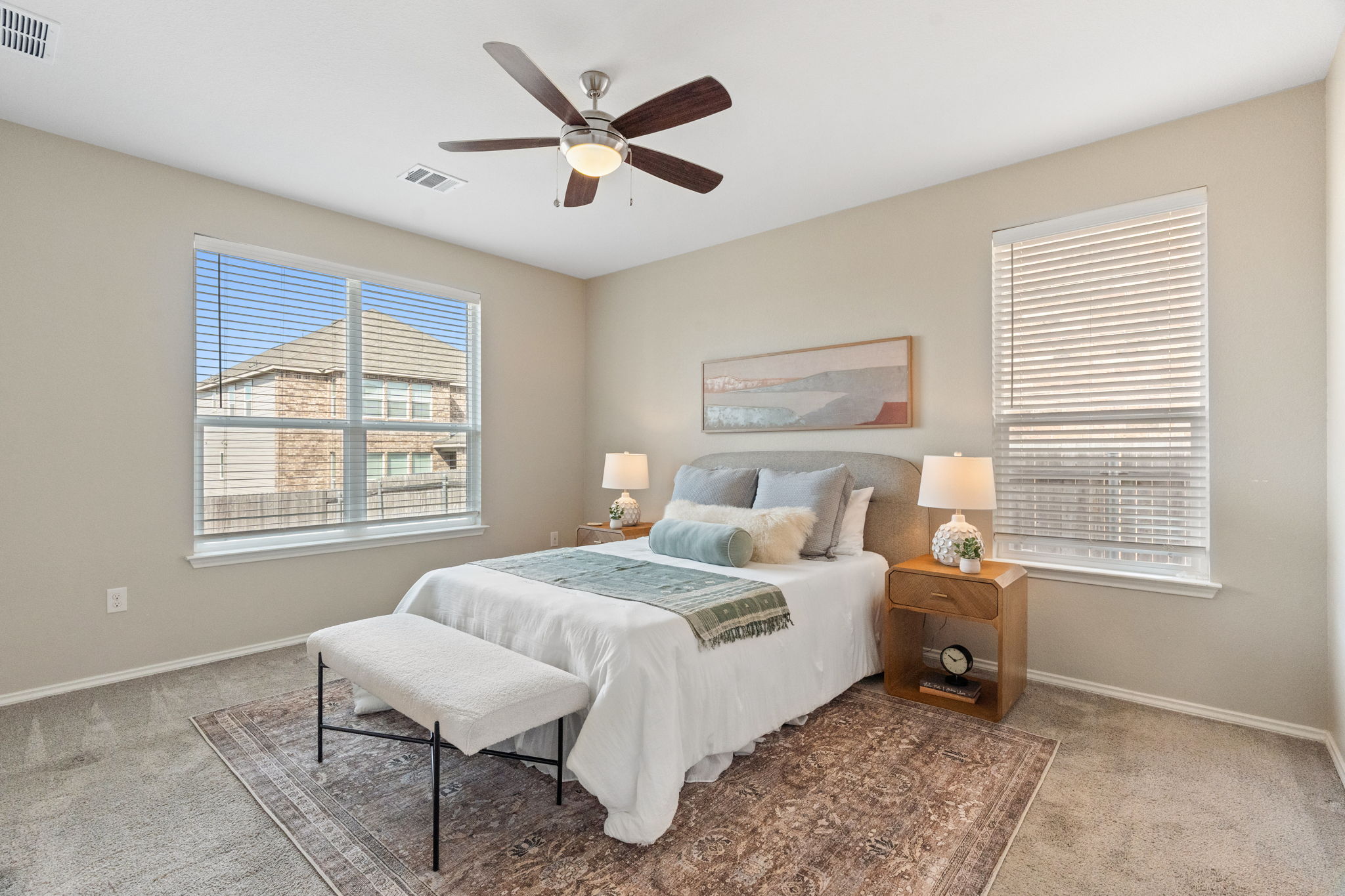 7504 Groundhog Way Austin, TX 78744 - Photo 10 of 22 a bedroom with a bed and a window