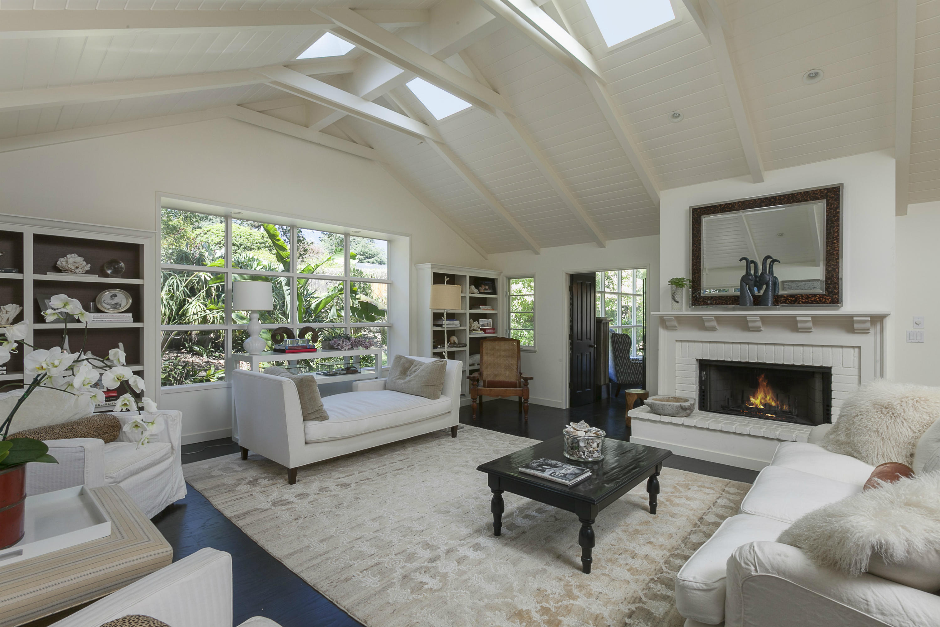 1381 East Valley Road Montecito, CA 93108 - Photo 4 of 13 a living room with furniture and a fireplace