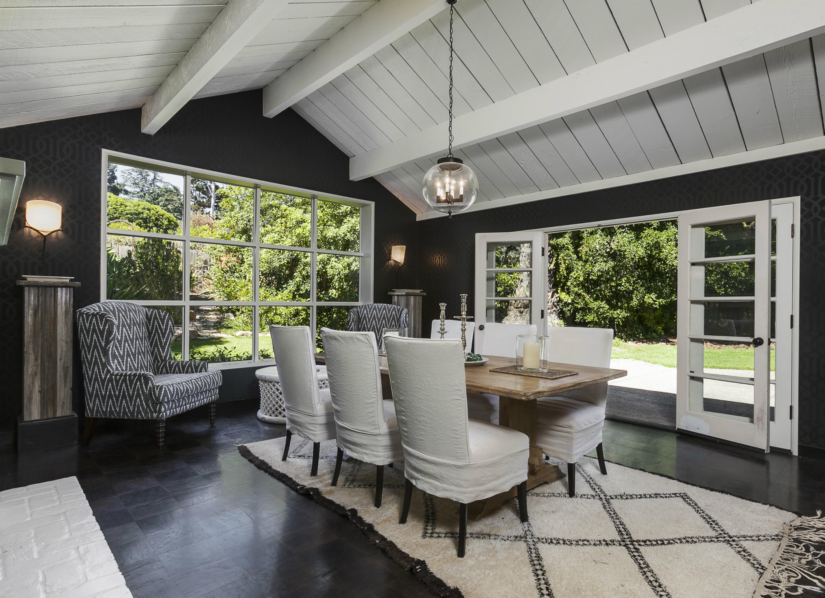 1381 East Valley Road Montecito, CA 93108 - Photo 6 of 13 a view of a dining room with furniture large windows and wooden floor
