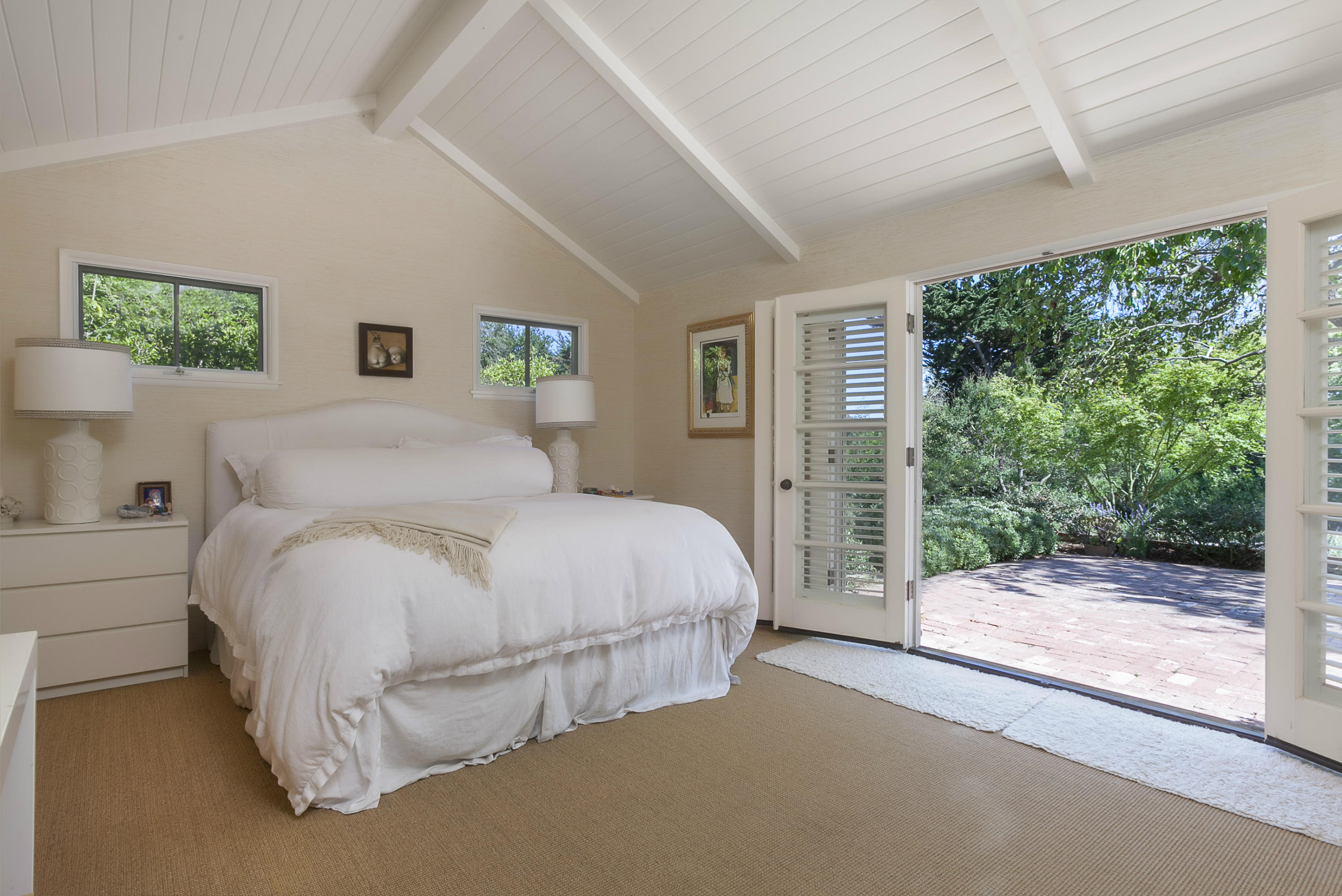 1381 East Valley Road Montecito, CA 93108 - Photo 10 of 13 a spacious bedroom with a bed and a large window