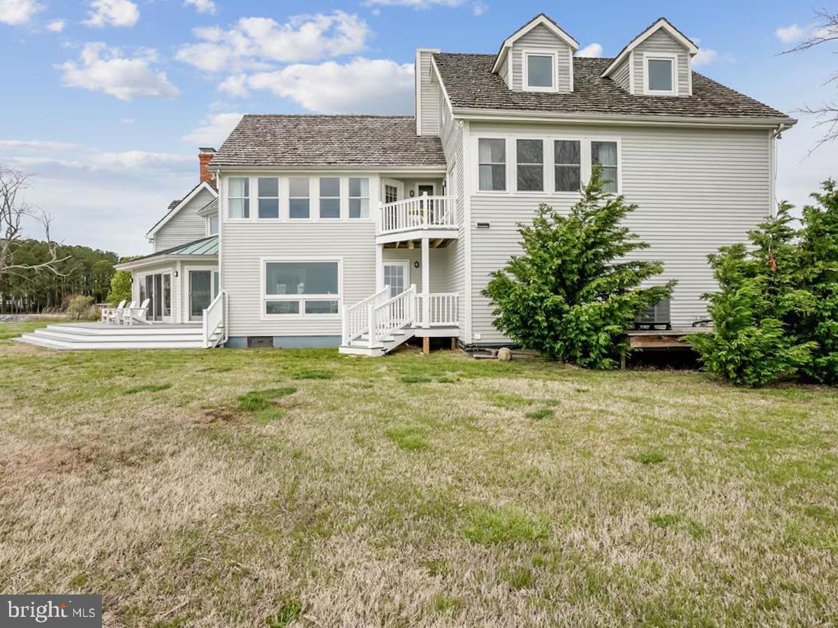 21642 Chicken Point Road Tilghman, MD 21671 - Photo 57 of 63 a front view of a house with garden