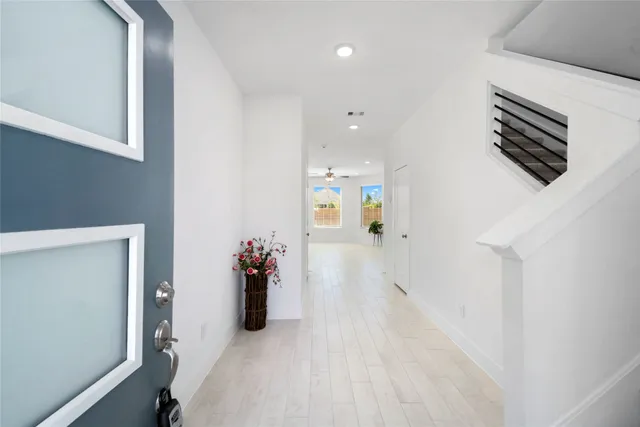 a view of a hallway with seating area