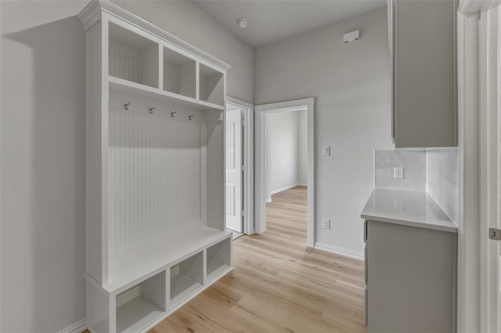 605 Tay Tay Way Springtown, TX 76082 - Photo 24 of 31 Entryway built-in storage bench with upper cubbies and coat hooks