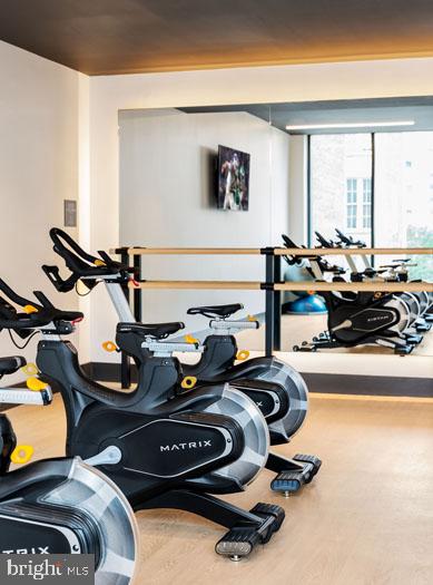 210 South 12th Street, Unit 0B128P Philadelphia, PA 19107 - Photo 30 of 45 a room with gym equipment and a large window