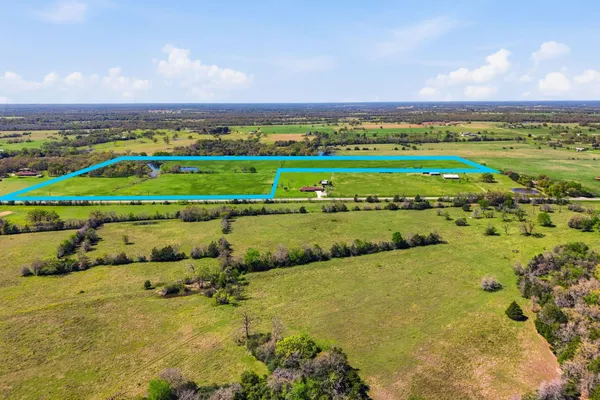 a view of a lake with houses in the back