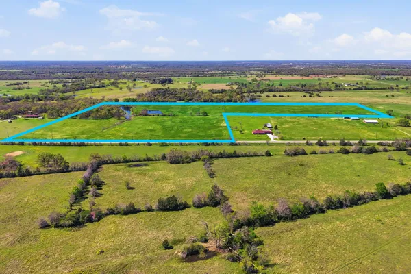 a view of a lake with a yard