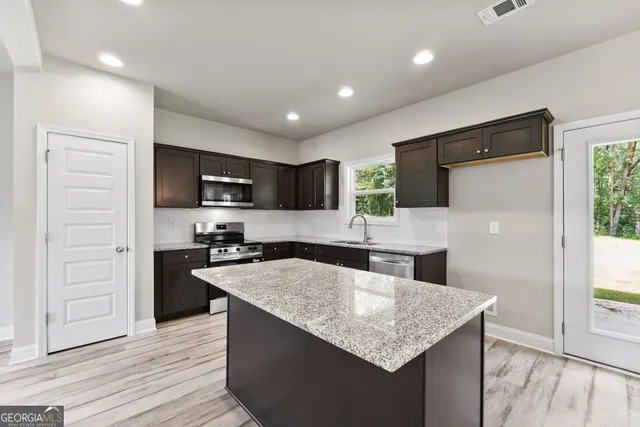 a view of a kitchen from the hallway