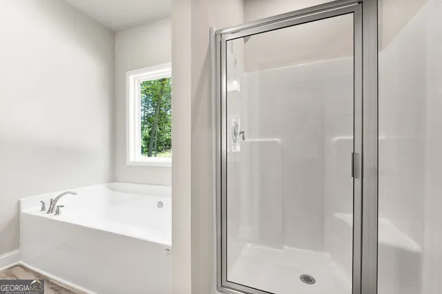 a bathroom with a granite countertop toilet a sink and a mirror