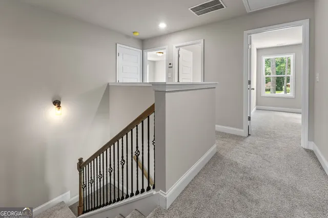 an empty room with closet and mirror