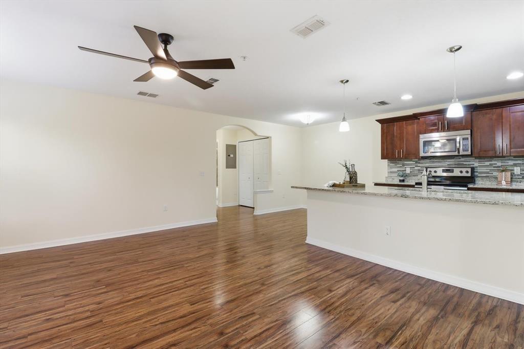 5041 Royal Palms Way, Unit 202 New Port Richey, FL 34652 - Photo 15 of 41 a view of kitchen with sink and wooden floor