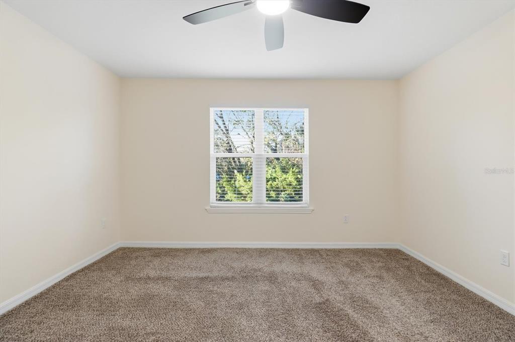 5041 Royal Palms Way, Unit 202 New Port Richey, FL 34652 - Photo 18 of 41 an empty room with a window