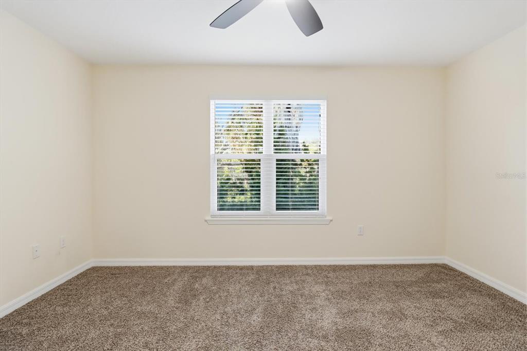 5041 Royal Palms Way, Unit 202 New Port Richey, FL 34652 - Photo 23 of 41 an empty room with a window