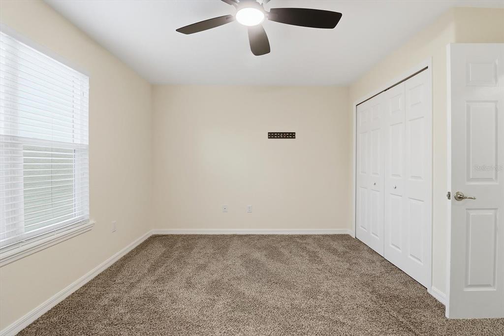 5041 Royal Palms Way, Unit 202 New Port Richey, FL 34652 - Photo 24 of 41 a view of an empty room with a window