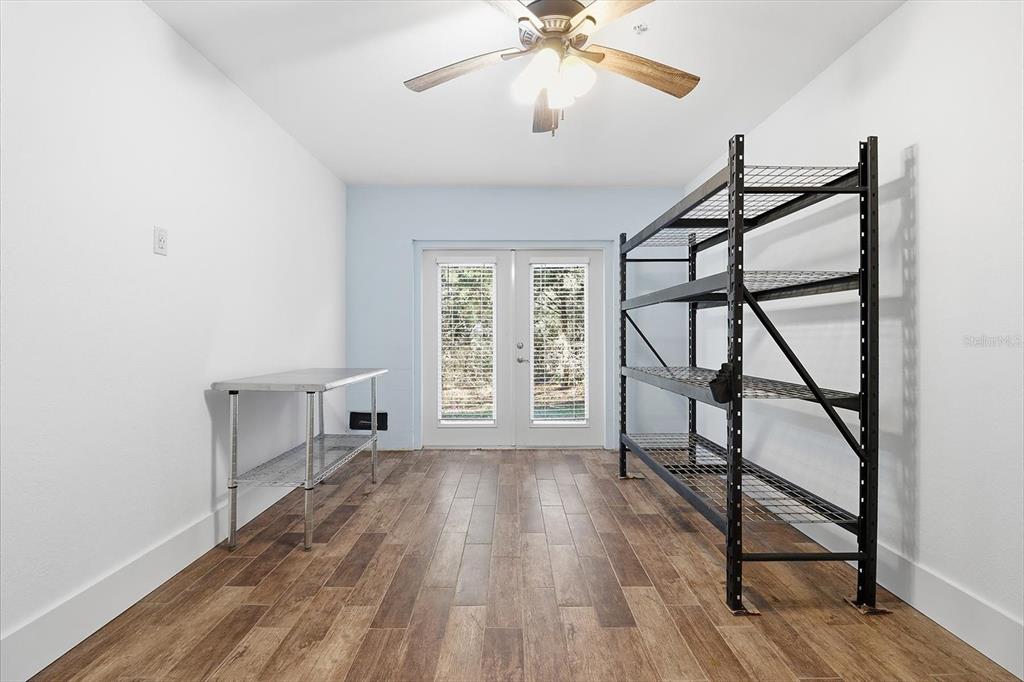5041 Royal Palms Way, Unit 202 New Port Richey, FL 34652 - Photo 30 of 41 wooden floor in an empty room with a window