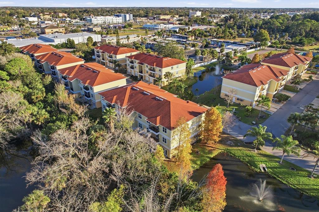5041 Royal Palms Way, Unit 202 New Port Richey, FL 34652 - Photo 35 of 41 an aerial view of residential houses with outdoor space