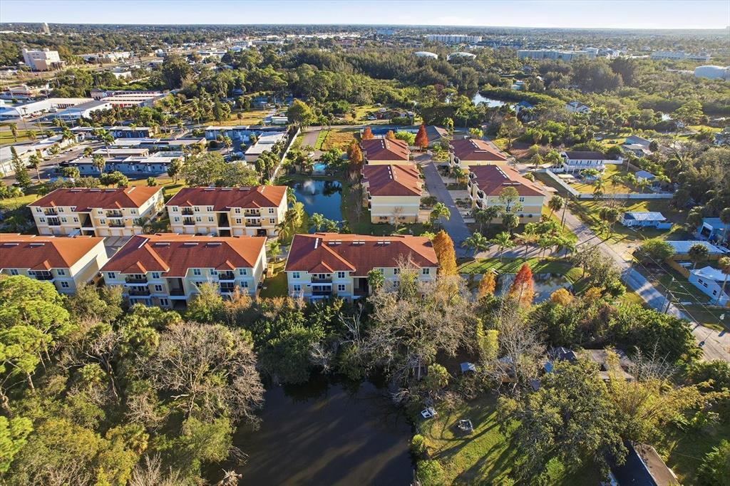 5041 Royal Palms Way, Unit 202 New Port Richey, FL 34652 - Photo 36 of 41 an aerial view of residential houses with city view