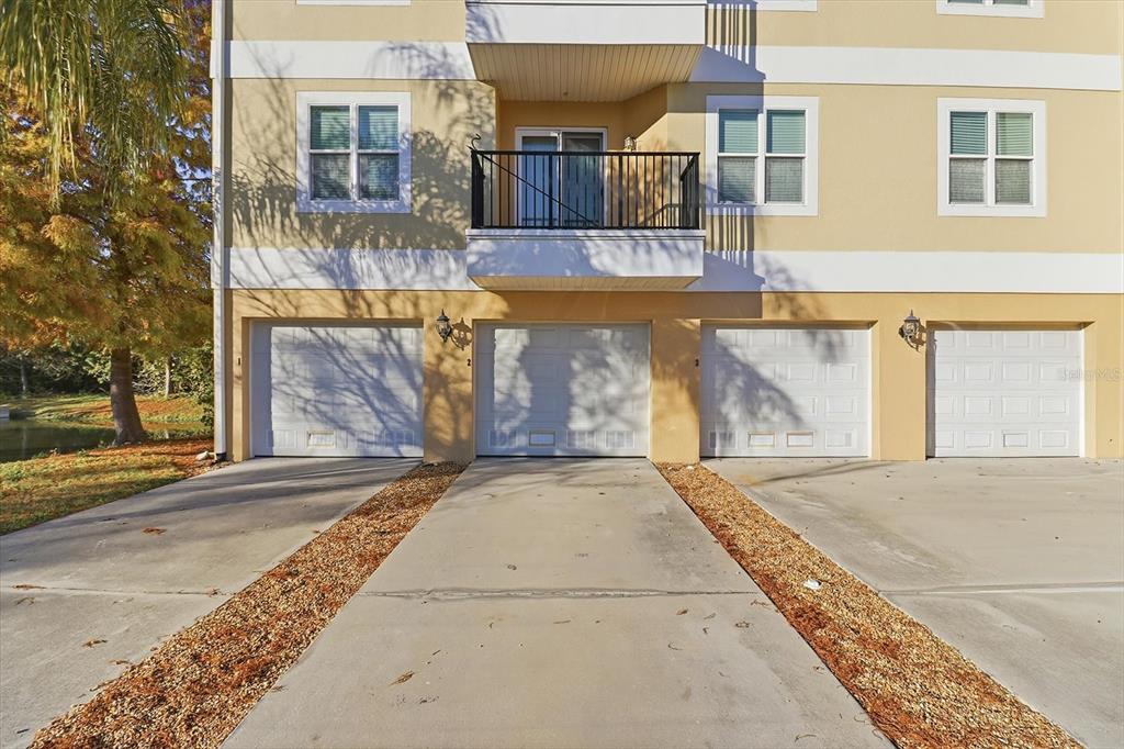 5041 Royal Palms Way, Unit 202 New Port Richey, FL 34652 - Photo 5 of 41 a view of a brick building with many windows