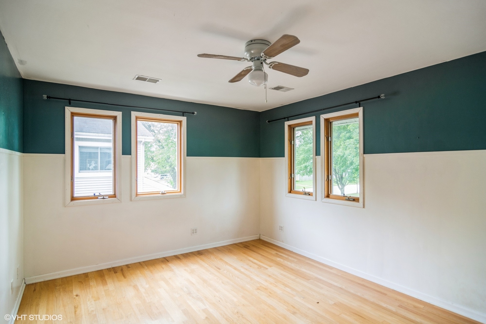 1009 Whitfield Road Northbrook, IL 60062 - Photo 16 of 25 a view of an empty room with wooden floor and a window