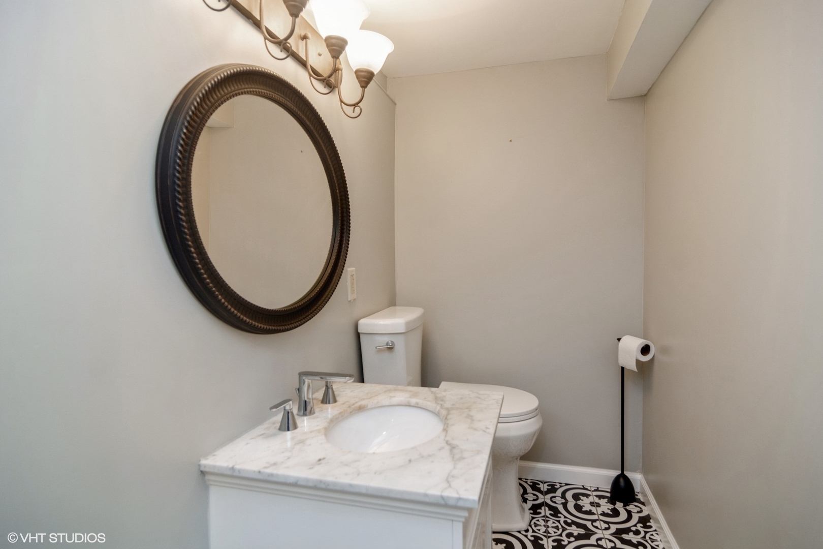 1009 Whitfield Road Northbrook, IL 60062 - Photo 23 of 25 a bathroom with a sink a toilet and a mirror