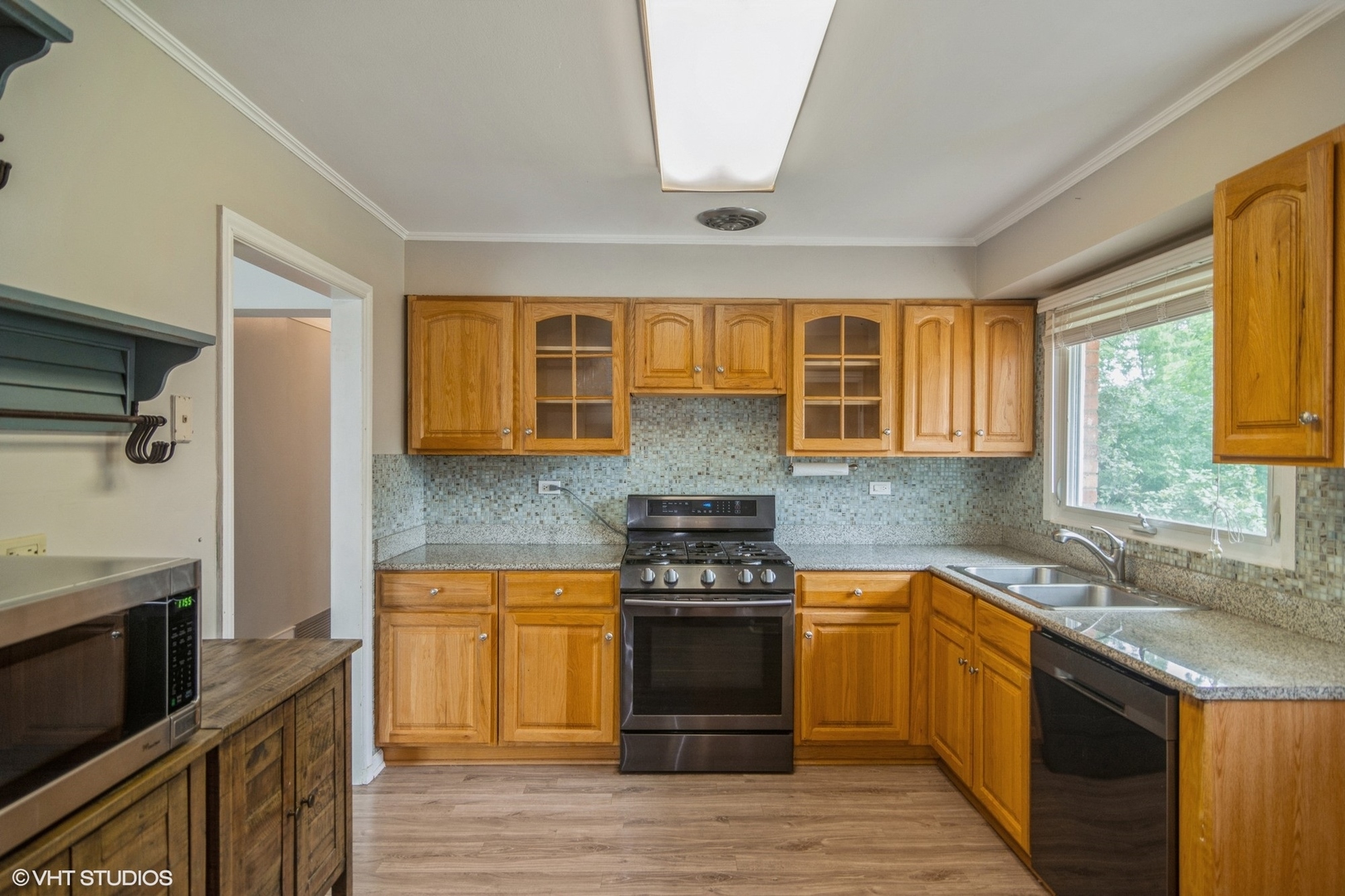 1009 Whitfield Road Northbrook, IL 60062 - Photo 10 of 25 a kitchen with stainless steel appliances granite countertop a stove and a sink