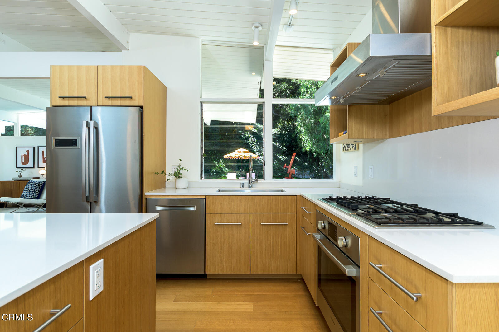 3525 El Lado Drive Glendale, CA 91208 - Photo 13 of 46 a kitchen with stainless steel appliances granite countertop a sink a stove and a refrigerator