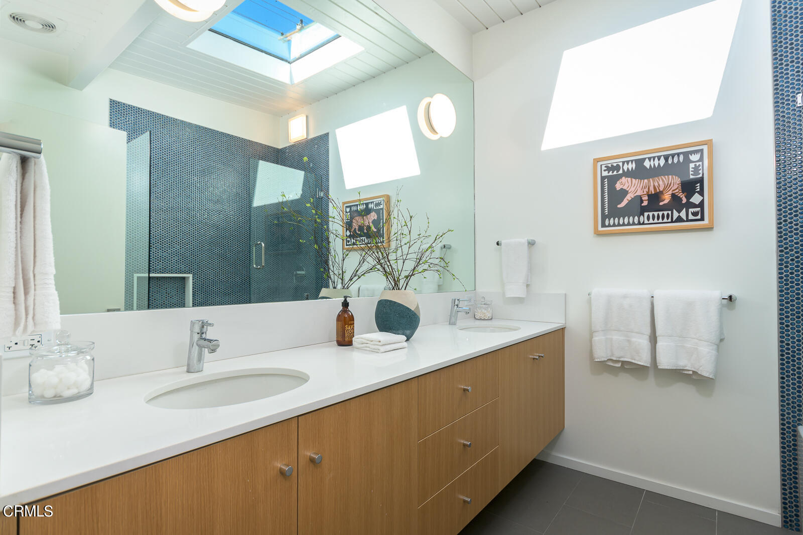 3525 El Lado Drive Glendale, CA 91208 - Photo 29 of 46 a bathroom with a double vanity sink and a mirror