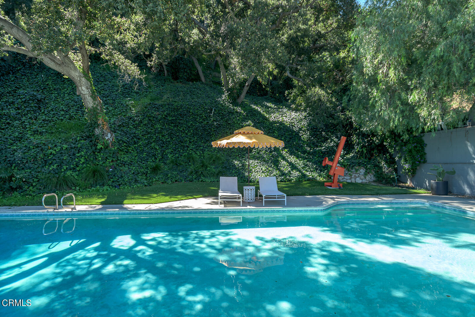 3525 El Lado Drive Glendale, CA 91208 - Photo 46 of 46 a backyard of a house with lots of green space and fountain
