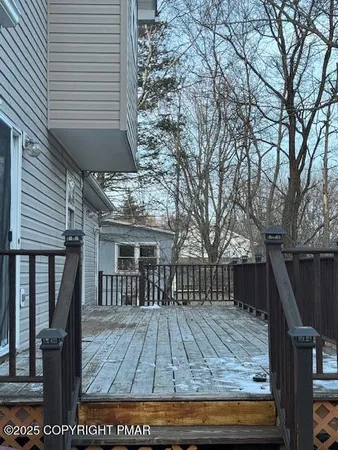 a view of backyard with deck