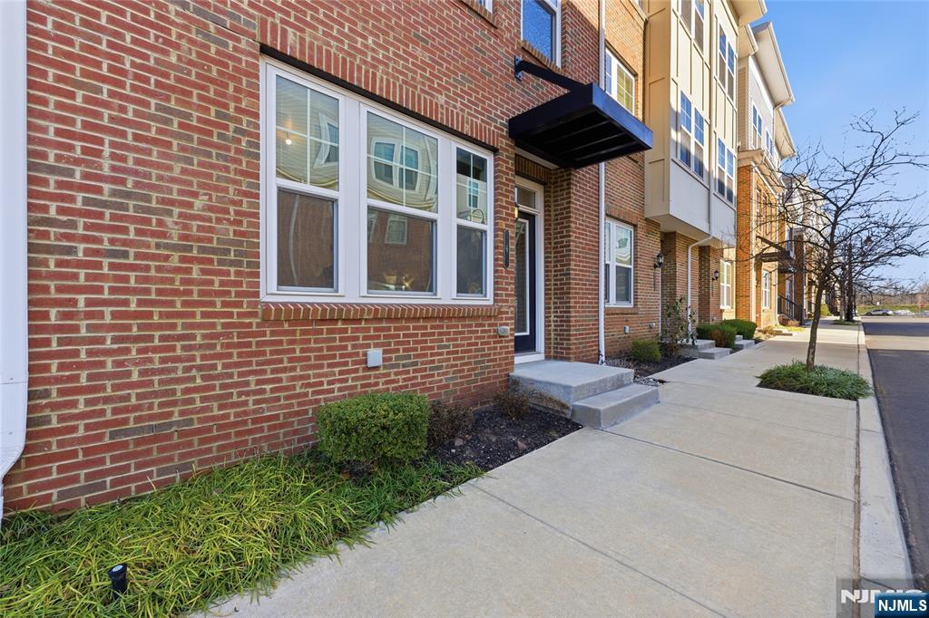 6 Bond Street North Brunswick, NJ 08902 - Photo 2 of 34 a view of a brick house with a yard