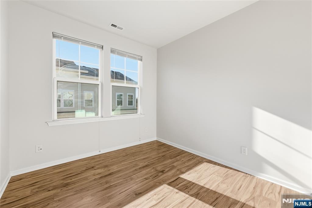 6 Bond Street North Brunswick, NJ 08902 - Photo 28 of 34 a view of an empty room with wooden floor and a window