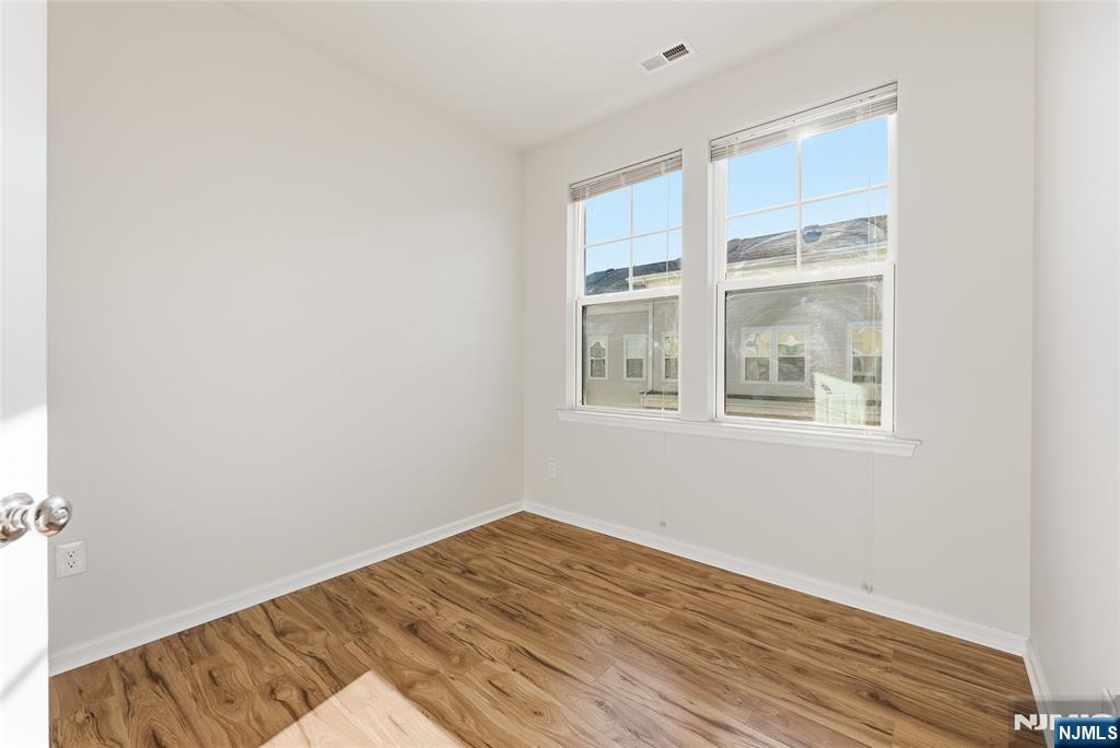 6 Bond Street North Brunswick, NJ 08902 - Photo 29 of 34 a view of empty room with wooden floor and fan