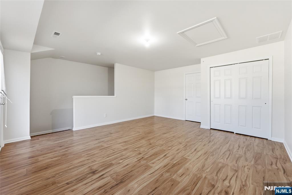 6 Bond Street North Brunswick, NJ 08902 - Photo 31 of 34 an empty room with wooden floor