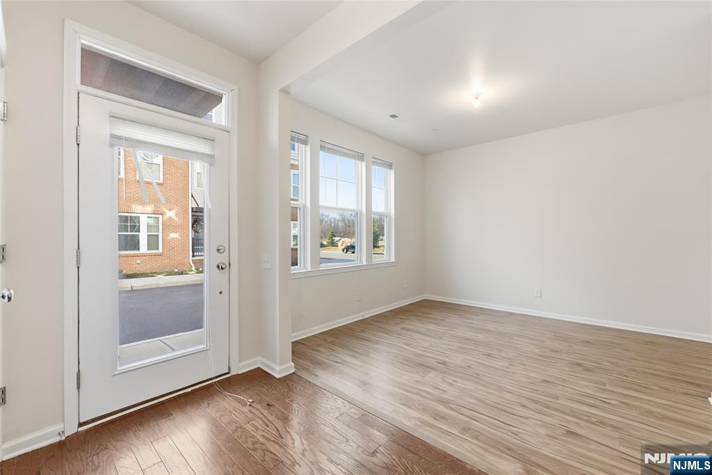 6 Bond Street North Brunswick, NJ 08902 - Photo 4 of 34 an empty room with wooden floor and windows