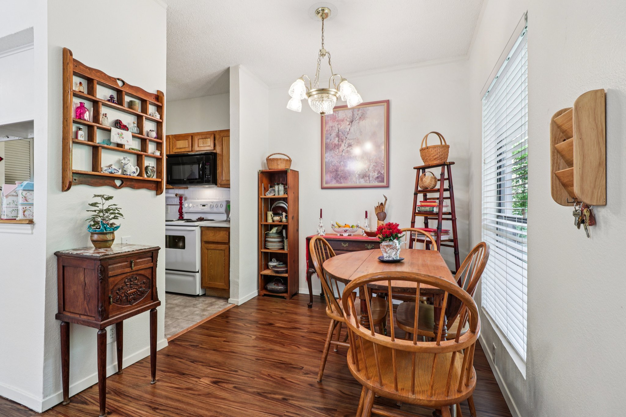 802 South 1st Street, Unit 121 Austin, TX 78704 - Photo 3 of 12 a view of a dining room with furniture and wooden floor