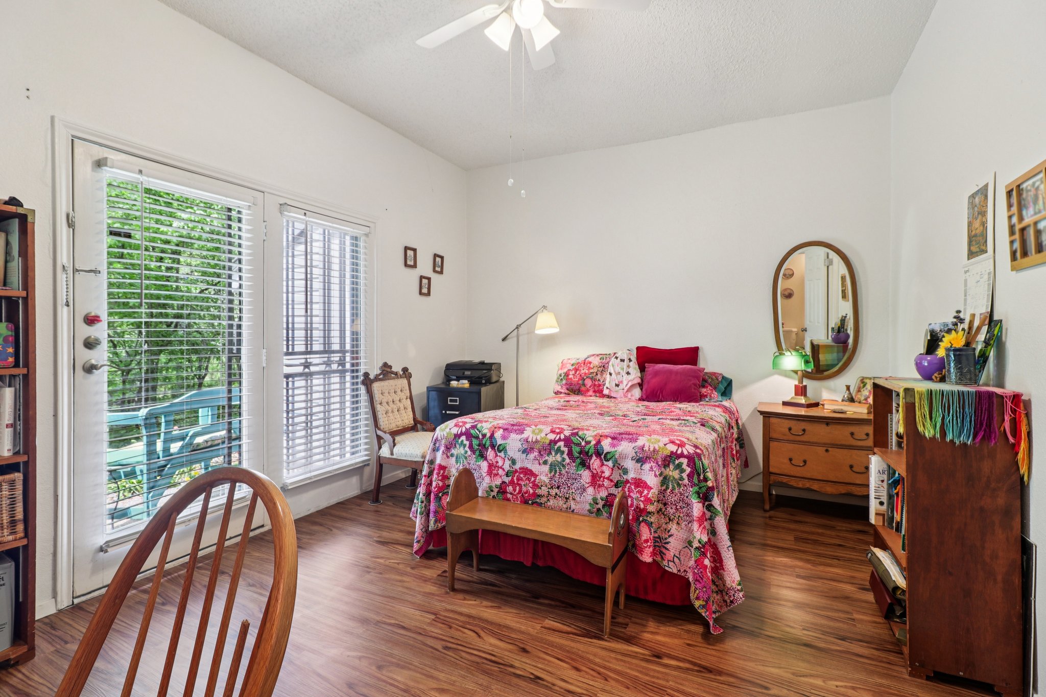 802 South 1st Street, Unit 121 Austin, TX 78704 - Photo 7 of 12 a bedroom with bed and wooden floor