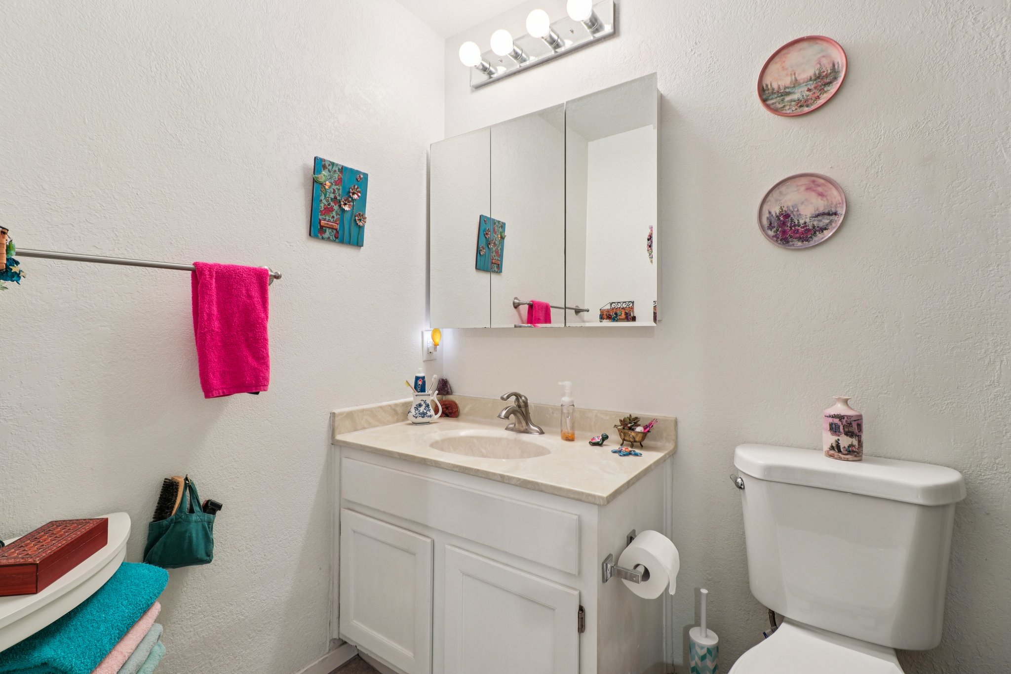 802 South 1st Street, Unit 121 Austin, TX 78704 - Photo 8 of 12 a bathroom with a sink mirror and vanity