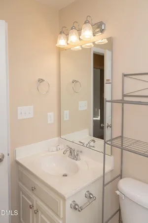 a bathroom with a toilet a sink and shower
