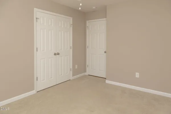 an empty room with closet
