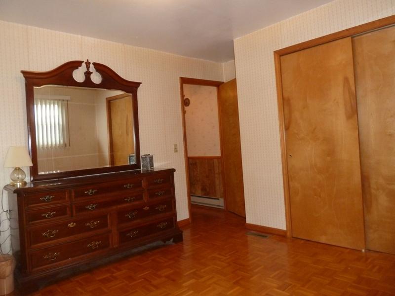 2275 Iron Ridge Road Rocky Mount, VA 24151 - Photo 11 of 16 a living room with a dresser and a mirror