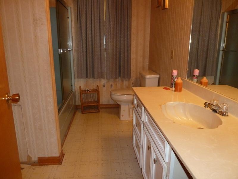 2275 Iron Ridge Road Rocky Mount, VA 24151 - Photo 12 of 16 a bathroom with a double vanity sink and a mirror