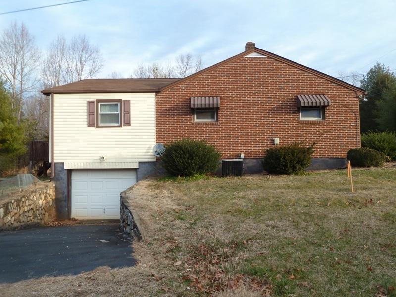 2275 Iron Ridge Road Rocky Mount, VA 24151 - Photo 14 of 16 a front view of a house with a yard