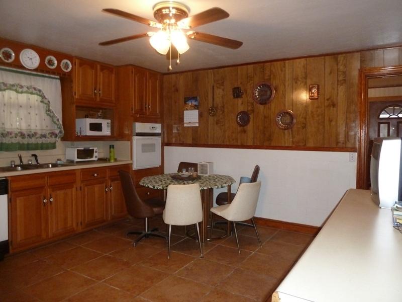 2275 Iron Ridge Road Rocky Mount, VA 24151 - Photo 5 of 16 a kitchen with a table chairs and a refrigerator
