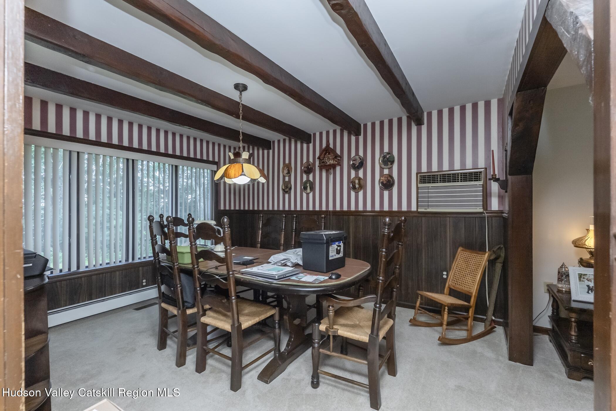 135 Hilltop Road Saugerties, NY 12477 - Photo 11 of 49 a dining room with furniture and a floor to ceiling window