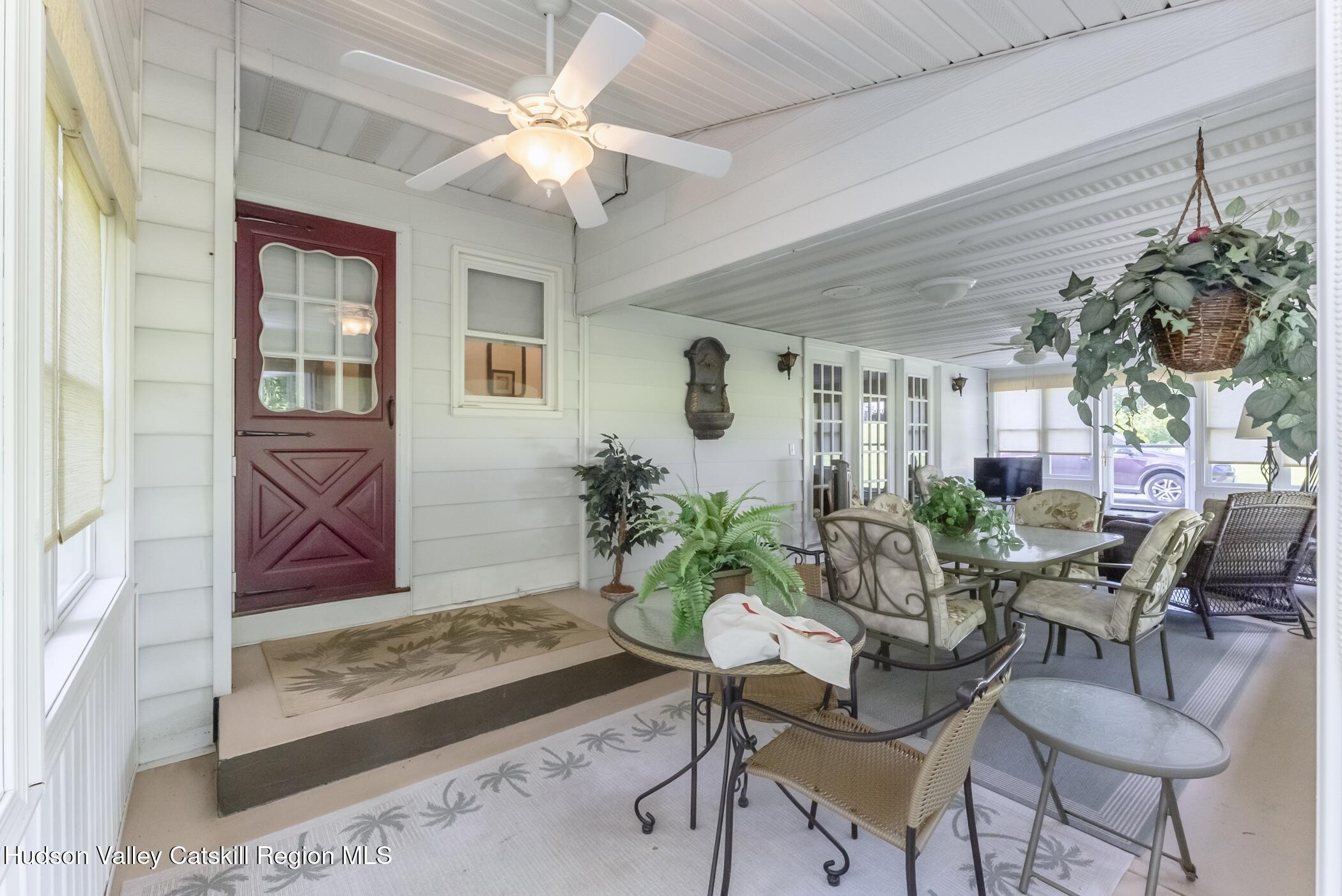 135 Hilltop Road Saugerties, NY 12477 - Photo 16 of 49 a view of a livingroom with furniture and a potted plant