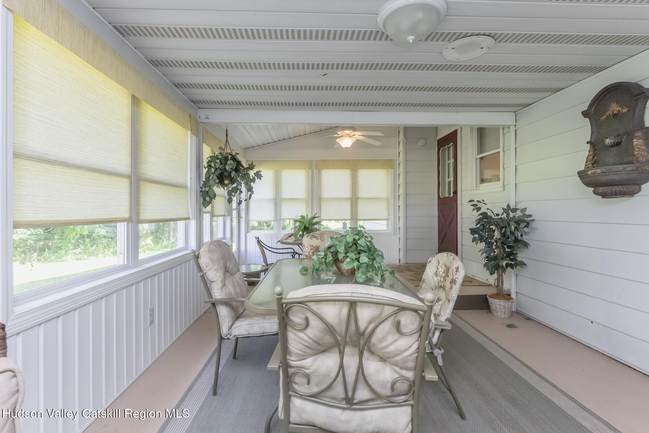 135 Hilltop Road Saugerties, NY 12477 - Photo 19 of 49 a view of a dining room with furniture window and outside view