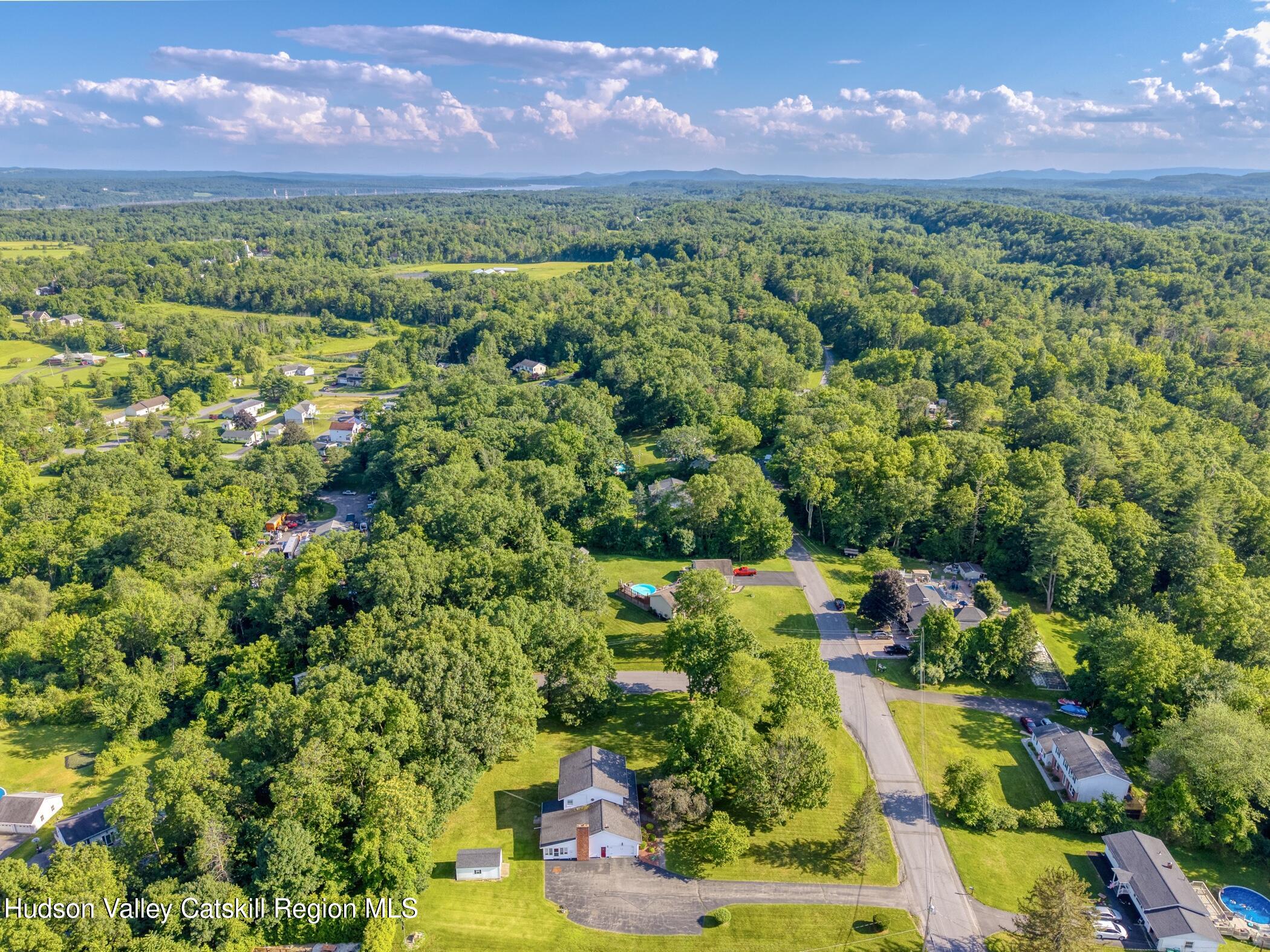 135 Hilltop Road Saugerties, NY 12477 - Photo 46 of 49 a view of a city with lush green forest