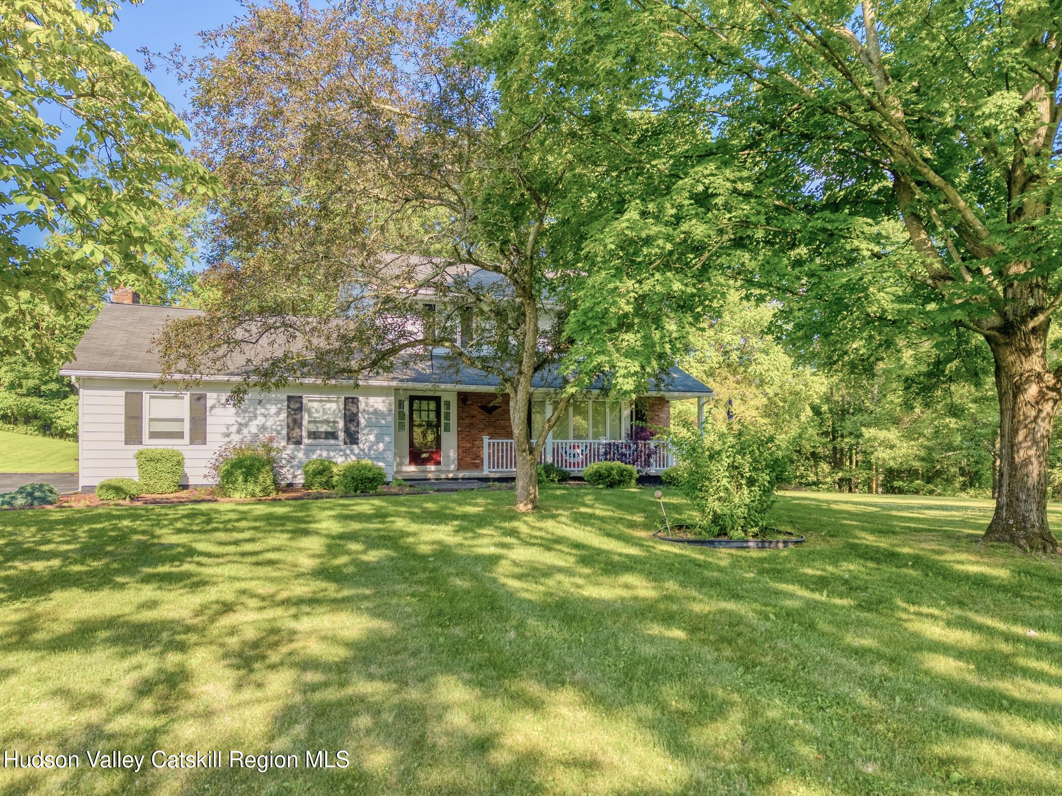 135 Hilltop Road Saugerties, NY 12477 - Photo 49 of 49 a front view of a house with a garden