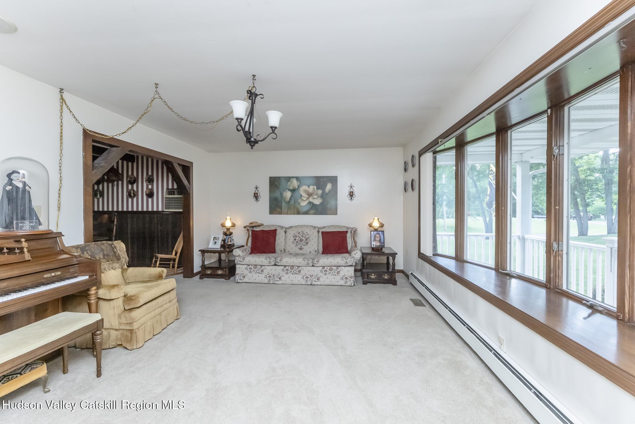 135 Hilltop Road Saugerties, NY 12477 - Photo 7 of 49 a living room with furniture and a large window