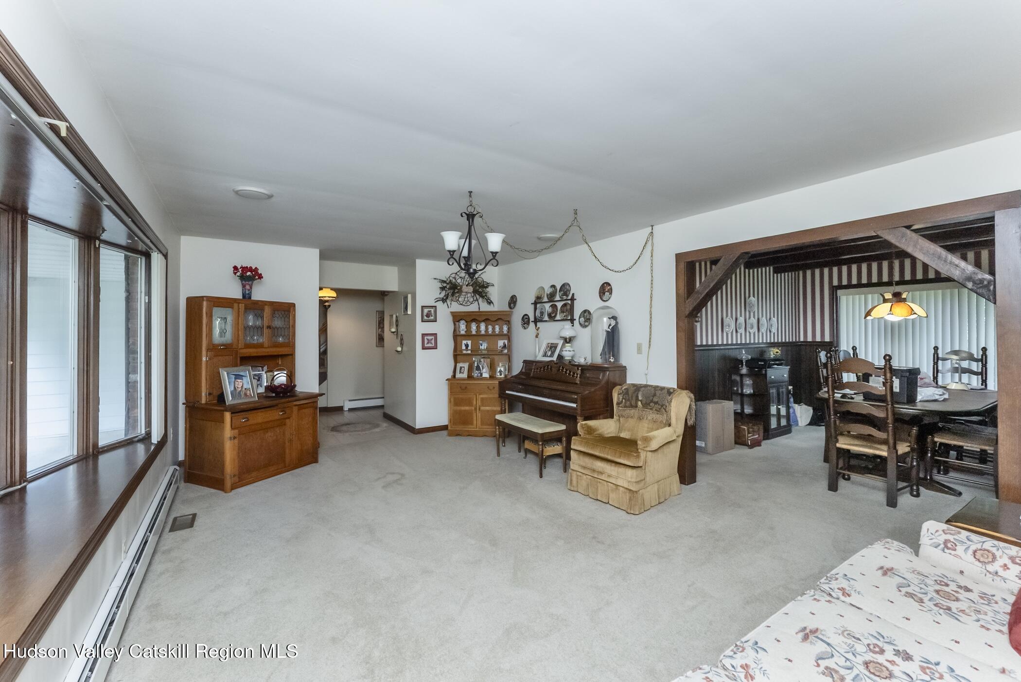 135 Hilltop Road Saugerties, NY 12477 - Photo 8 of 49 a living room with furniture and a flat screen tv